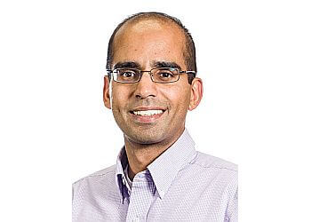 Calgary dentist Dr. Jagatjit Dhillon - BEACON SMILES DENTAL image 1